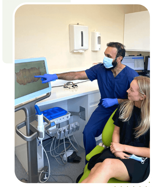 Dentist showing 3D scan to patient at Stable Court Dental Surgery